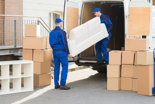 Packed boxes and wrapped furniture ready for a home removal in North London