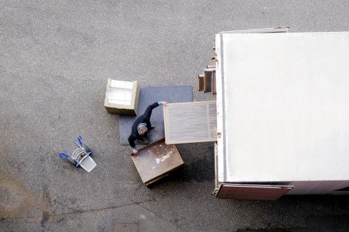 Professional movers packing household items for a local house move