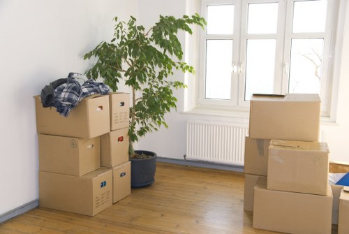 Professional movers handling furniture in a Tufnell Park flat