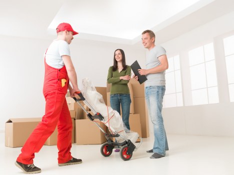 Packed boxes and furniture ready for van removal service