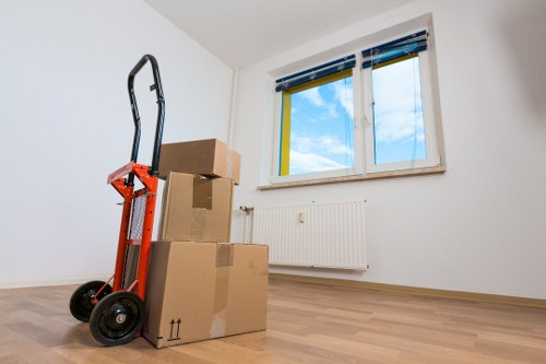 Moving team handling furniture in a Tufnell Park street
